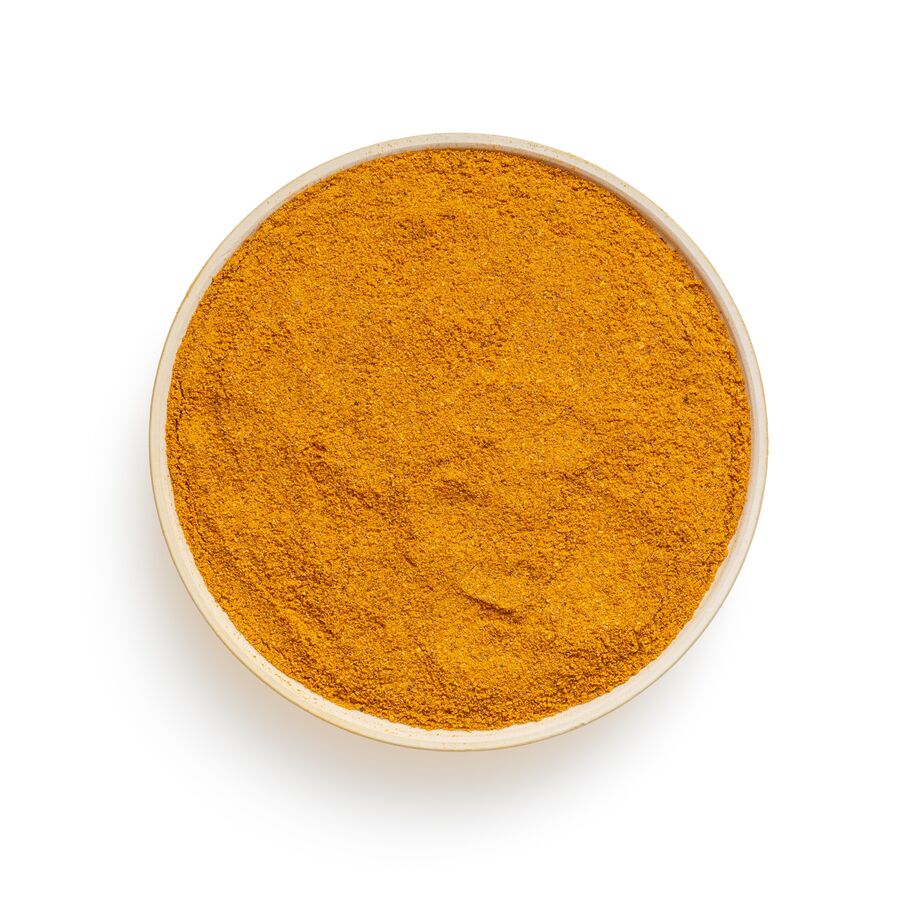 A bowl of ground turmeric root